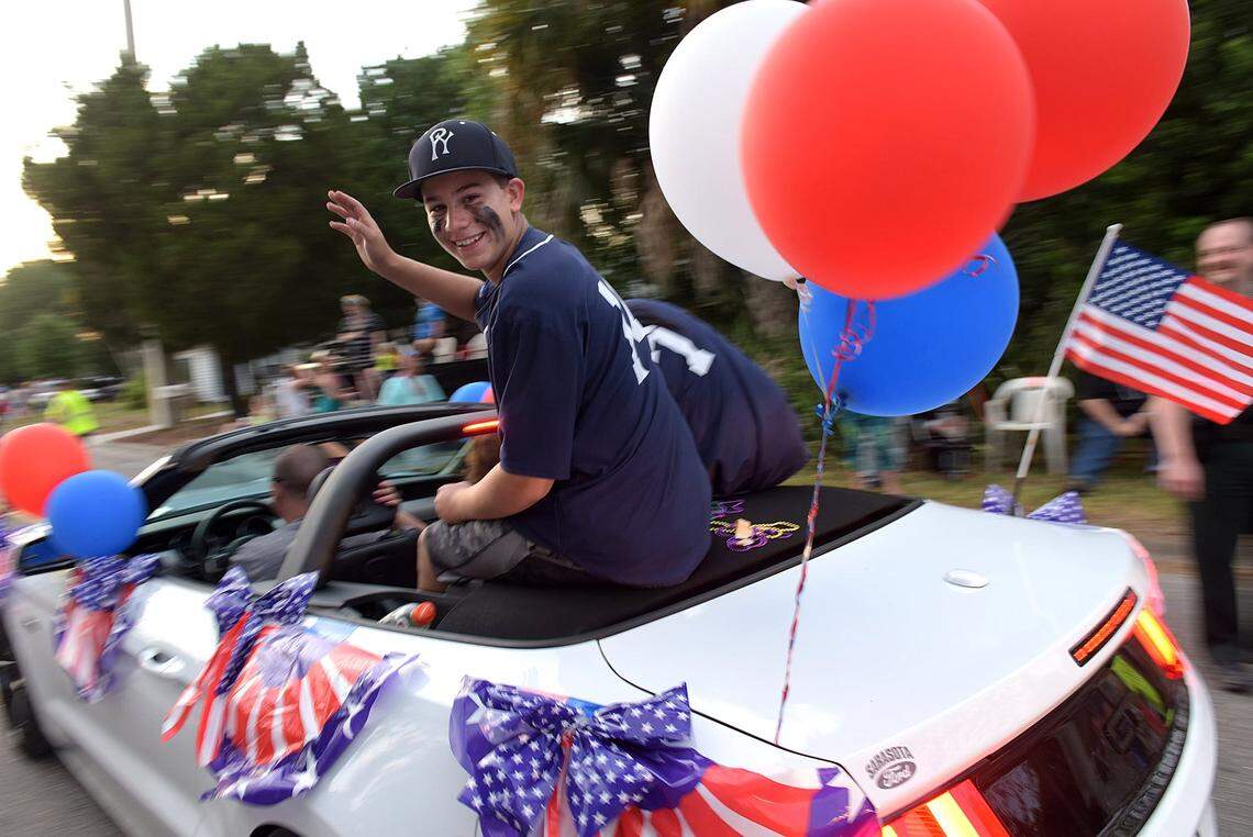 A player from the Palmetto Yankees waves during the annual DeSoto Heritage Grand Parade in this file photo.