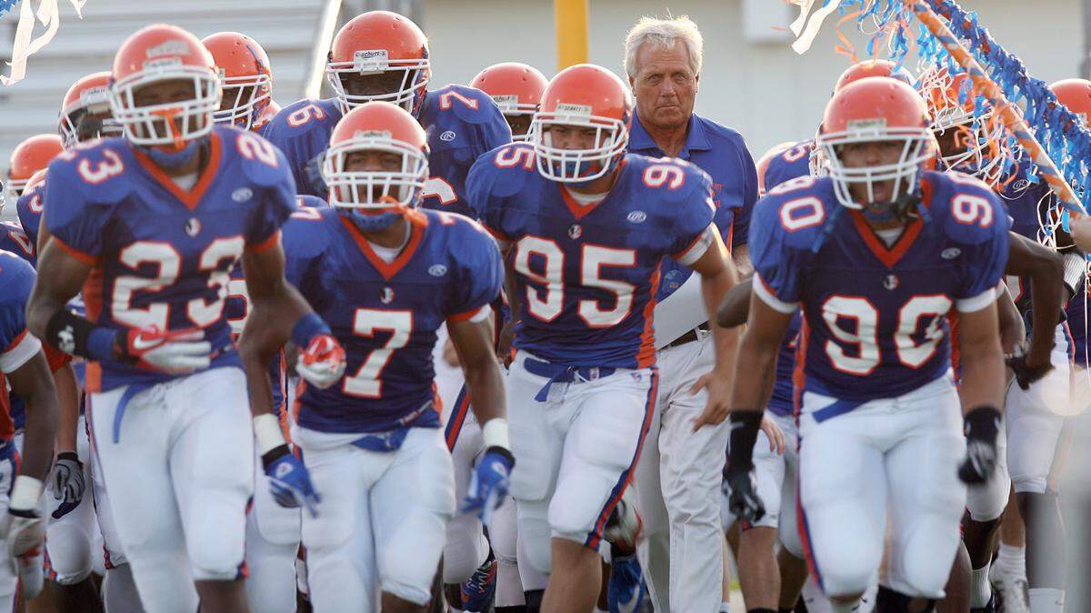 The Southeast High School football team enters the field at Kiker Stadium for an Aug. 26, 2011, game in Bradenton. HERALD FILE PHOTO