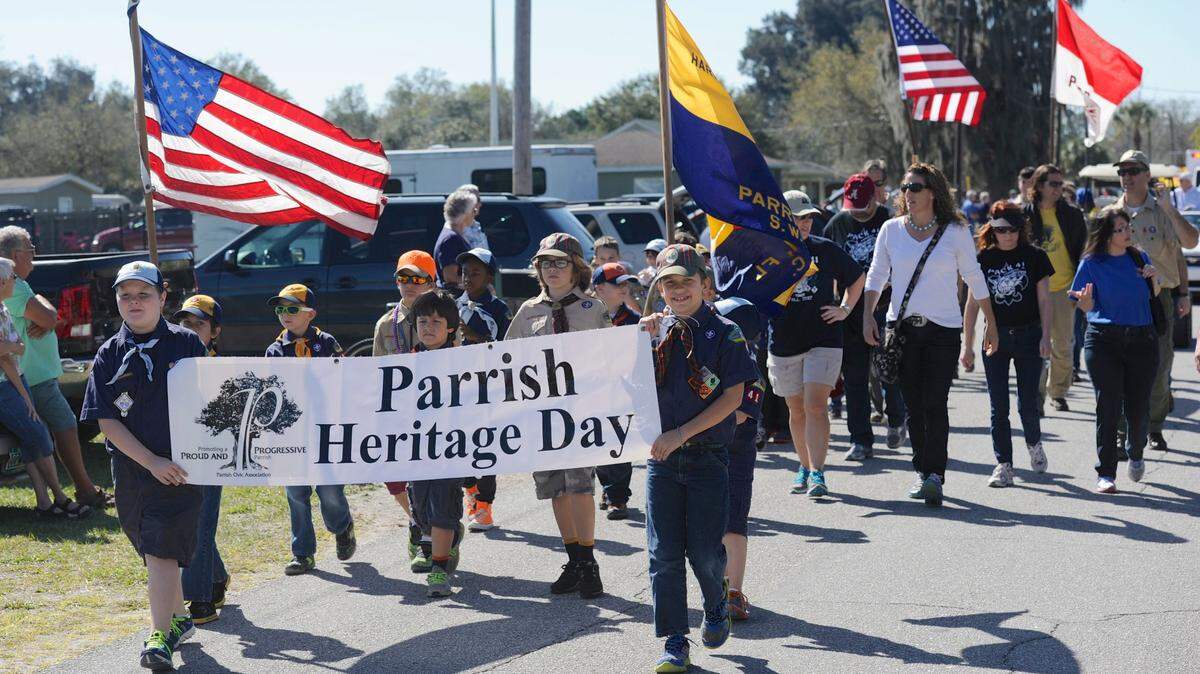 The Parrish Heritage Day Parade makes its way past crowds gathered along 121st Ave in Parrish. 
 HERALD FILE PHOTO