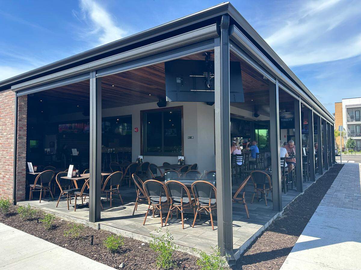 Retractable siding at Ed’s Tavern, 1305 108th St. E., Bradenton, offer guests a unique inside-outside look. The new sports bar opened in January.