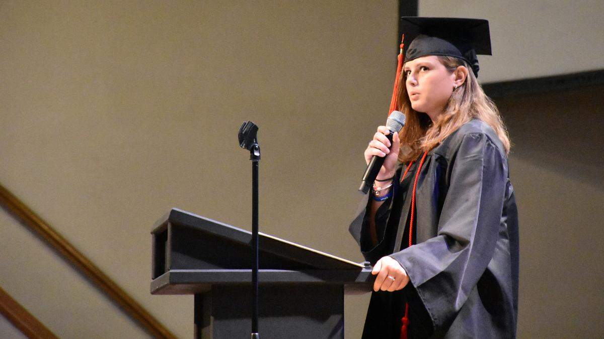 Student speaker Lydia Kovats addresses friends and family at the 2019 Inspiration Academy graduation ceremony. In her speech, she explained how attending the Christian school helped her build a closer relationship with God.