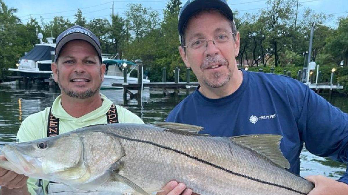 Jason Woodman and Tom George with a 41-inch snook caught during the 27th Annual Rough Rider Andy Brown Memorial Fishing Tournament on June 4, 2022.