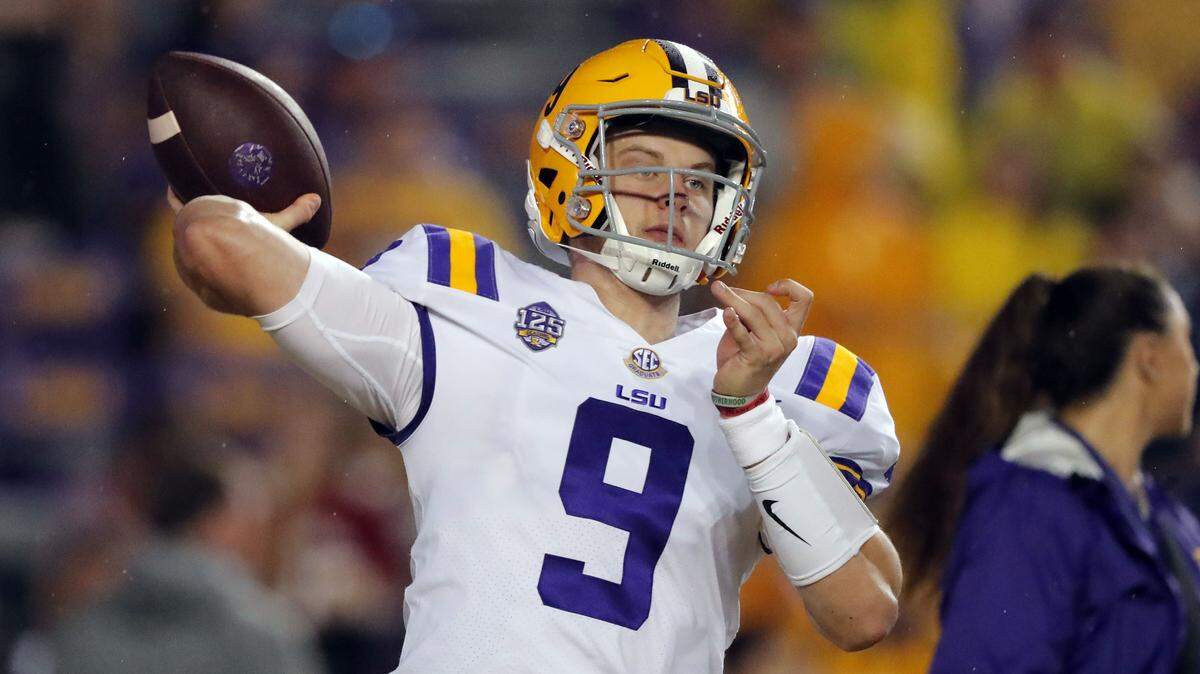 LSU quarterback Joe Burrow (9) warms up before an NCAA college football game against Mississippi in Baton Rouge, La., Saturday, Sept. 29, 2018.