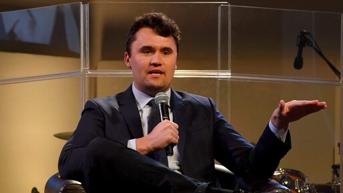 Turning Point USA President Charlie Kirk addresses the audience as he sits with Godspeak Calvary Chapel Pastor Rob McCoy in front of a capacity crowd in Newbury Park on Monday, Jan. 30, 2023.
