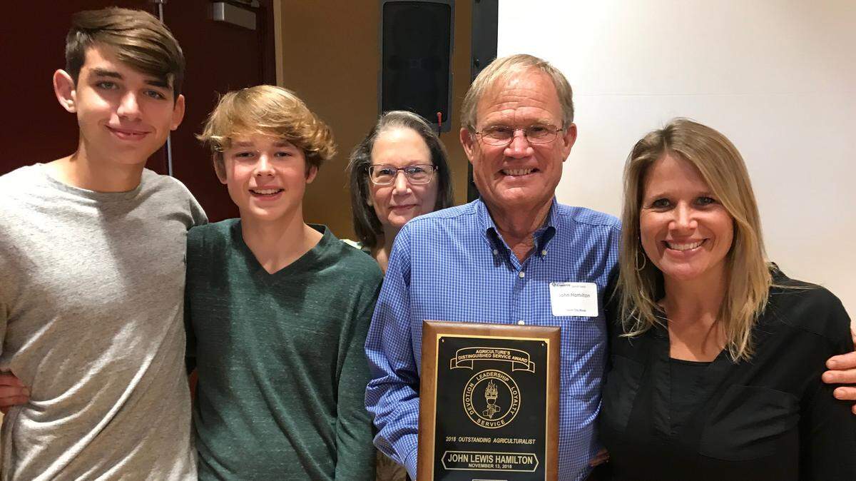 Oustanding Agriculturist John Hamilton is shown, from left with grandsons Jeb and Reid King, wife Patricia, and daughter Shelby King.