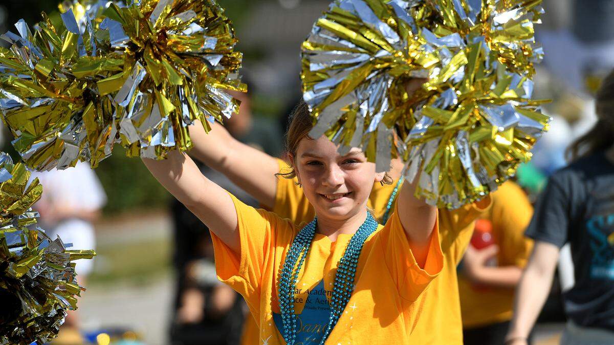 A young girl marches with Star Academy of Dance & Aerial Arts during the Hernando DeSoto Historical Society’s Children’s Parade on Friday, April 7, 2023 in Palmetto.