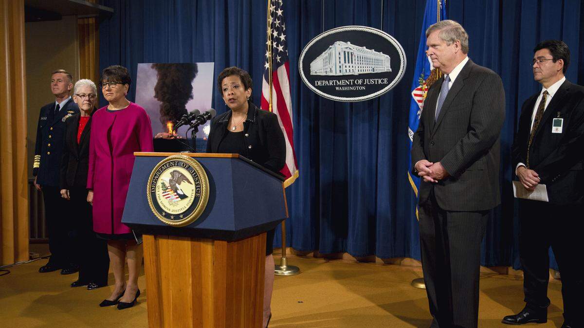 Attorney General Loretta Lynch, center, with, from left, U.S. Coast Guard Commandant Adm. Paul Zukunft, EPA Administrator Gina McCarthy, Commerce Secretary Penny Pritzker, Lynch, Agriculture Secretary Tom Vilsack, and Deputy Interior Secretary Mike Connor, speaks during a news conference at the Justice Department in Washington, Monday, Oct. 5, 2015, to announce resolution of federal and state claims against BP for the April 2010 Deepwater Horizon oil spill, and the restoration of natural resources in the Gulf of Mexico. The Justice Department and five states have finalized a settlement of more than $20 billion arising from the 2010 Deepwater Horizon oil spill in the Gulf of Mexico. (AP Photo/Manuel Balce Ceneta)