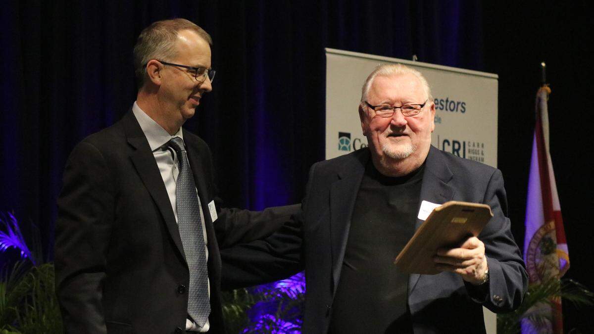 Mayor Wayne Poston, right, accepted the Manatee Chamber of Commerce Chairman’s Award on behalf of the City of Bradenton on Wednesday night for the city’s work on the CityCentre building and other downtown improvements. Presenting the award was outgoing chamber chairman Bill Poulton.