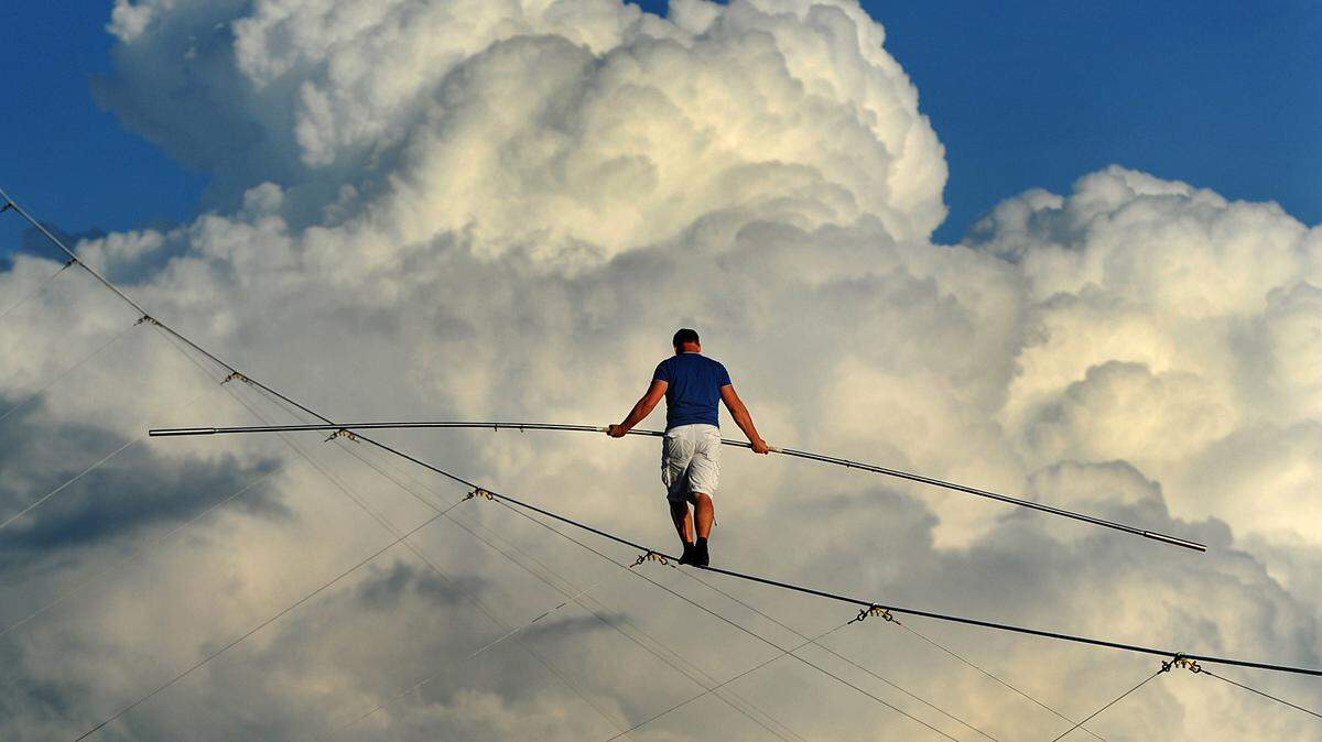 Nik Wallenda rehearses on a high wire as the sun lowers on a section of land near Nathan Benderson Park in Sarasota in October 2015.