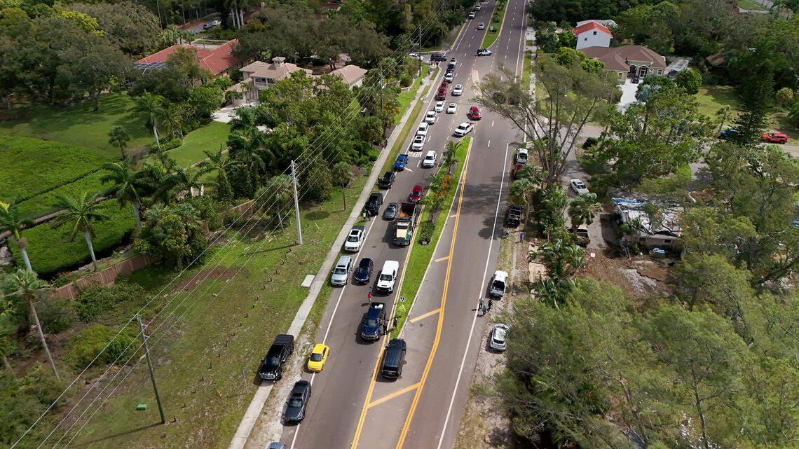 Cars line up to cross the Palma Sola Causeway at a roadblock in the aftermath of Hurricane Helene in Manatee County on Friday, Sept. 27, 2024.