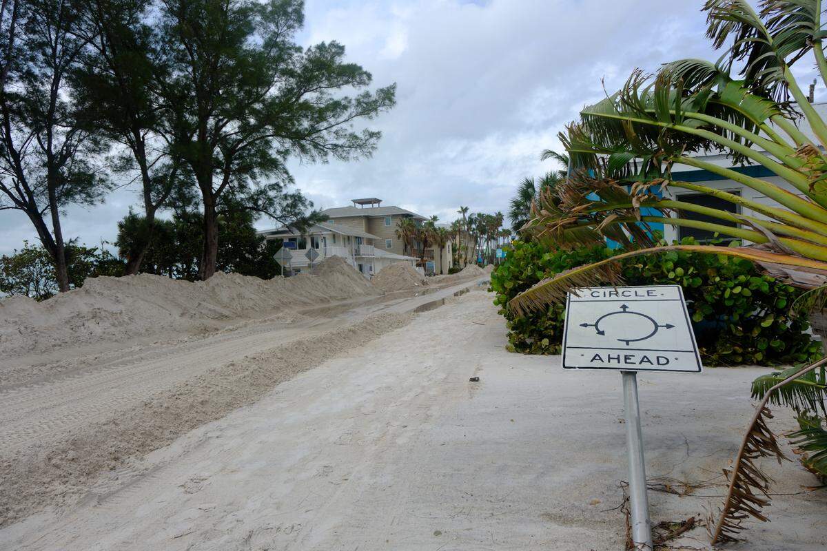 Up to 5 feet of sand covered Gulf Drive on Sat., Sept. 28, 2024, after Hurricane Helene battered Anna Maria Island as a Category 4 storm in the Gulf of Mexico.