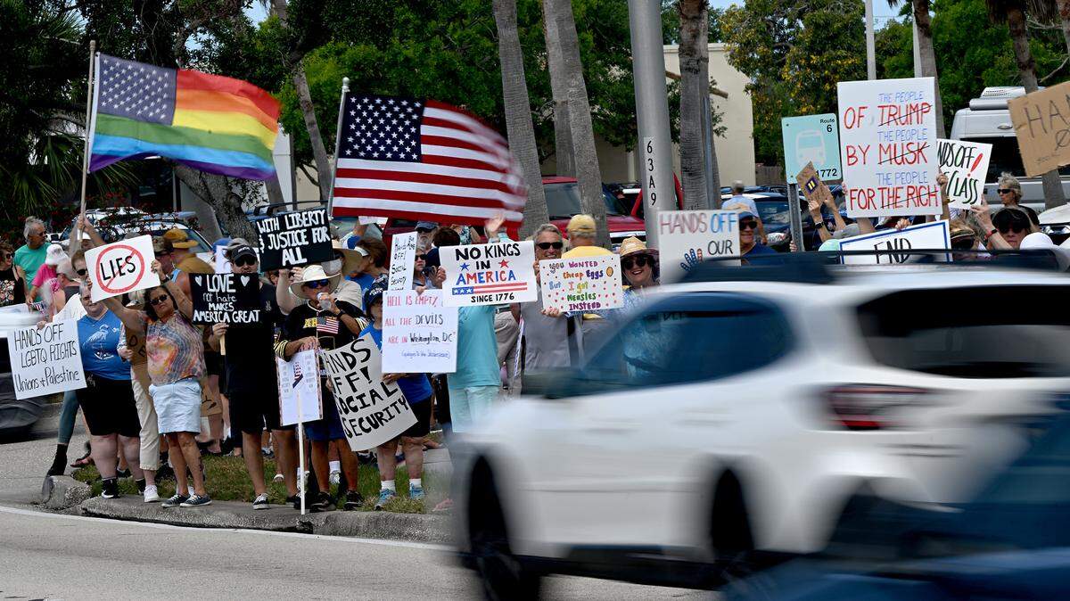 Hundreds of protestors gathered Saturday, April 5, 2025, on Cortez Road West in one of the many national “Hands off” protests against President Donald Trump’s policies.