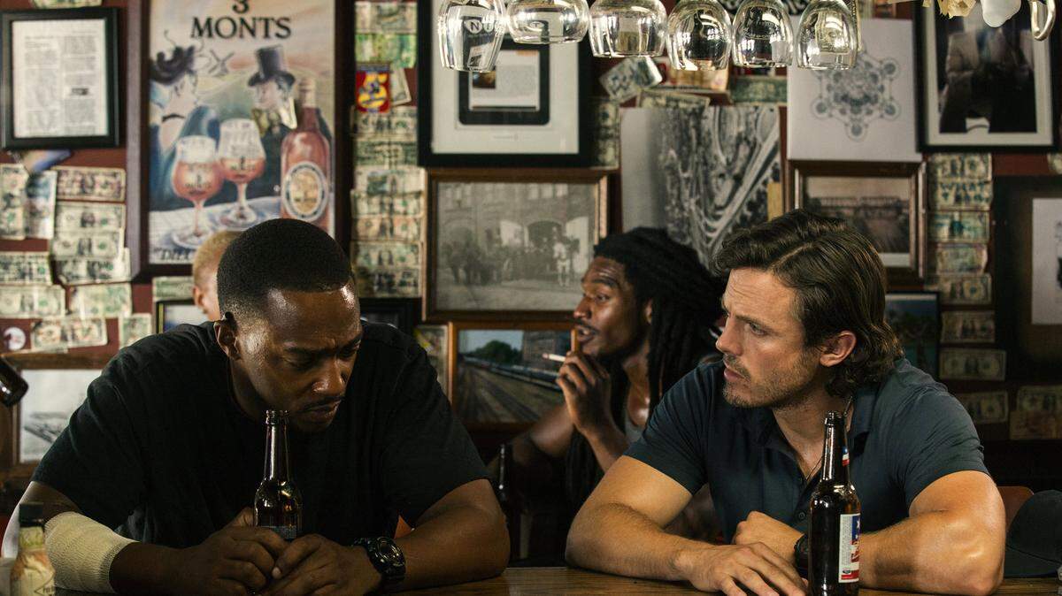 Anthony Mackie, left, and Casey Affleck star in a scene from "Triple 9." Bob Mahoney/Open Road Films via AP