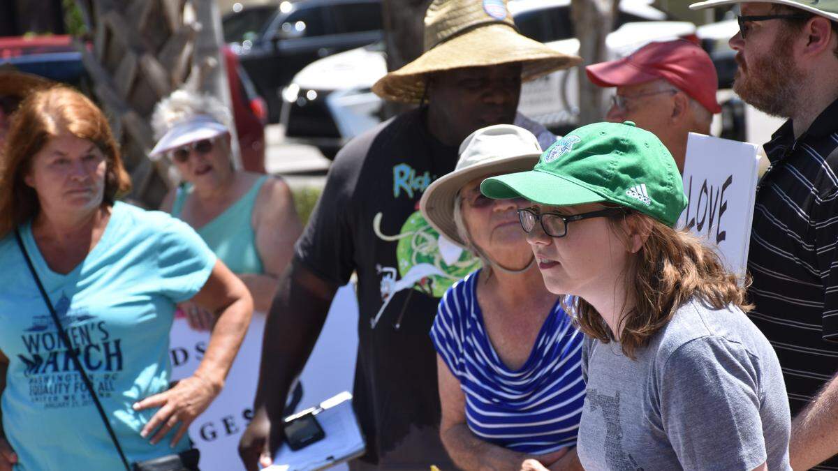 A group of 30 protestors led by Liv Coleman (right), a former Democrat State Rep. candidate, urged Congressman Vern Buchanan to pass legislation closing immigration detention centers like the one in Homestead, Fla., in downtown Bradenton on July 2, 2019.