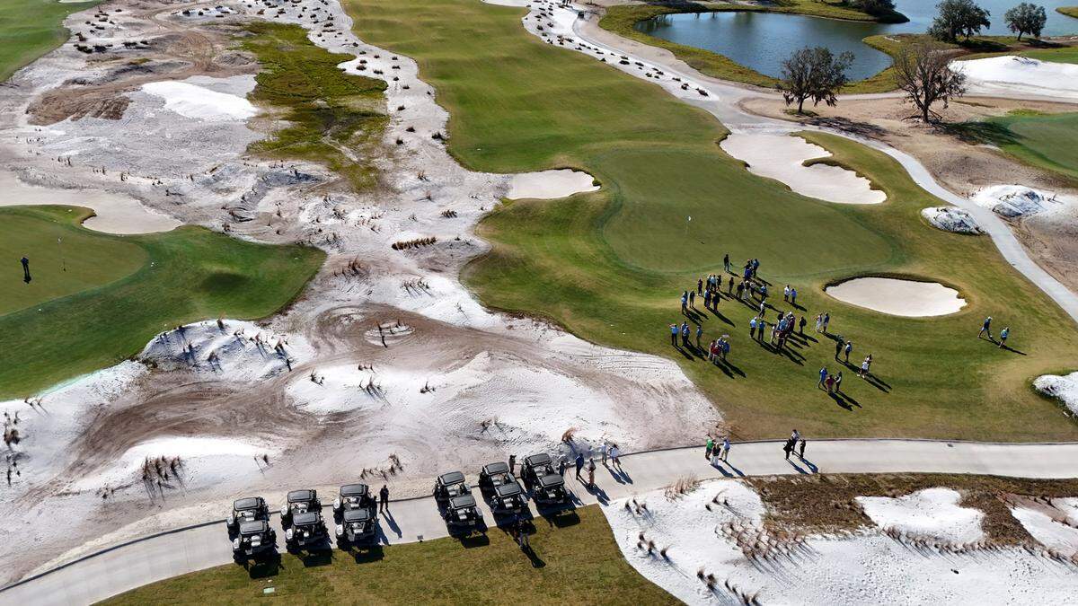 A group gathers for the ribbon-cutting at the Soleta Golf Club in Myakka City.