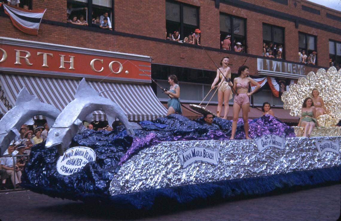 A parade float sponsored by the Anna Maria Island Chamber of Commerce passes through downtown Bradenton on Manatee Avenue in the De Soto Celebration Parade. On the float were Carolyn Meeker, Carol Woods, Betty Sue Burton, Charlene Miller, Sylvia Wiggins, and Jeanne Roat in 1949.