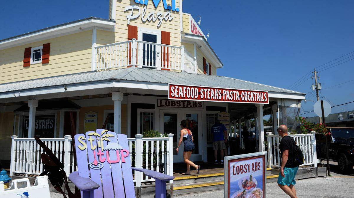 Customers walk into the Lobstahs resturant in the Anna Maria Island Plaza in Holmes Beach. The proposed ordinance calls for increases across the board, including for merchants, boat dealers and boat yards, hotels, contractors and dry cleaners, to name a few. GRANT JEFFERIES/Bradenton Herald