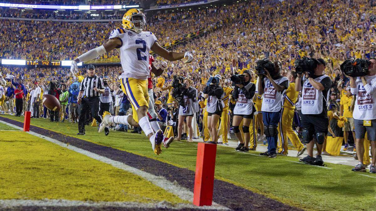 In this Sept. 29, 2018, file photo, LSU wide receiver Justin Jefferson runs the ball and scores during an NCAA college football game in Baton Rouge, La. The Georgia Bulldogs must run a gauntlet of four straight games against Southeastern Conference opponents currently ranked in the Top 25, beginning with Saturday’s trip to No. 13 LSU.
