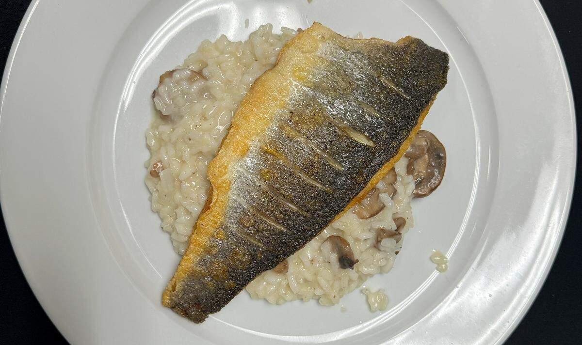 Branzino is the crispy sea bass over house-made mushroom truffle risotto at Sofra Kitchen Bar & Bistro in downtown Bradenton.