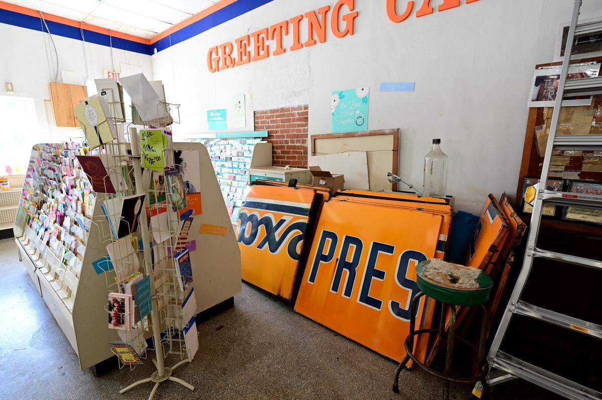 A Rexall sign sits in pieces in the back of the store. The sign is destined to become family keepsakes as there are plans to frame sections for family members. Pelot’s Rexall Pharmacy in downtown Bradenton closed its doors on Wednesday after over 130 years in business. Shown on March 4, 2026.