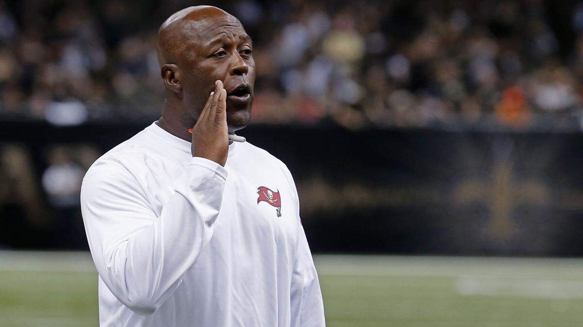 Tampa Bay Buccaneers head coach Lovie Smith calls out in the second half of an NFL football game against the New Orleans Saints in New Orleans, Sunday, Sept. 20, 2015. (AP Photo/Bill Haber)