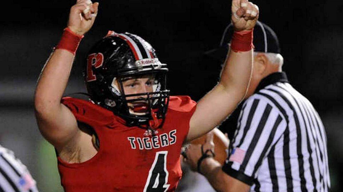 Palmetto's Kyle O'Halloran celebrates a touchdown during the Palmetto/Southeast game on Nov. 7 in this file photo. 
 TIFFANY TOMPKINS-CONDIE/Bradenton Herald