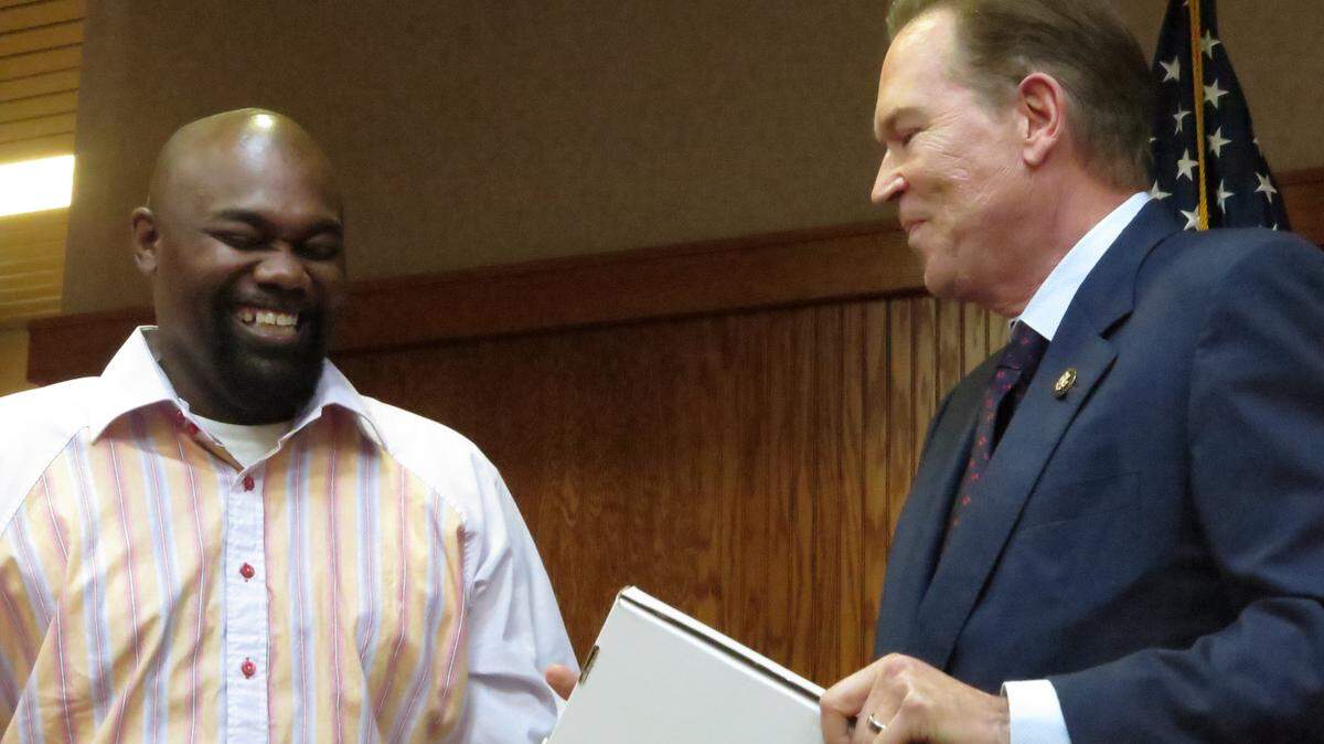 Lorenzo Browner, 46, shares a humorous moment Friday evening with Rep. Vern Buchanan during the Congressional Teacher Awards ceremony in Sarasota.AMARIS CASTILLO/Bradenton Herald