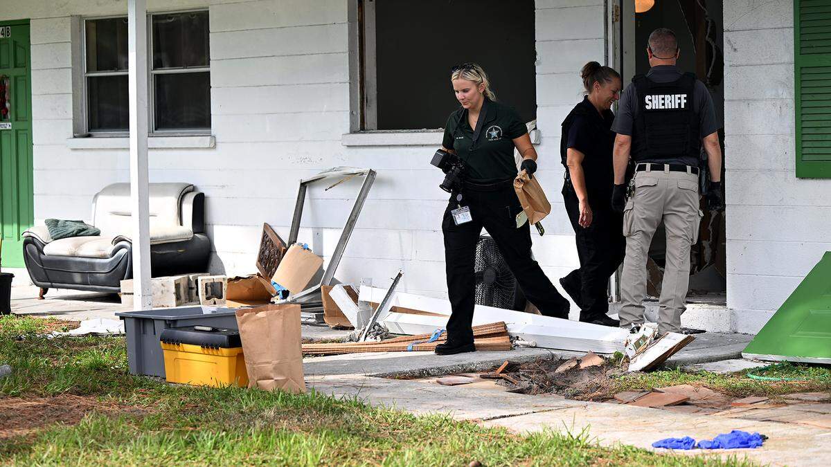 Manatee County Sheriff’s Office deputies continue to gather evidence and investigate at the scene of an hours-long standoff in the 800 block of 63rd Avenue West on September 11, 2025. While attempting to serve a warrant related to armed robbery, the suspect fired shots at deputies, the sheriff’s office said.