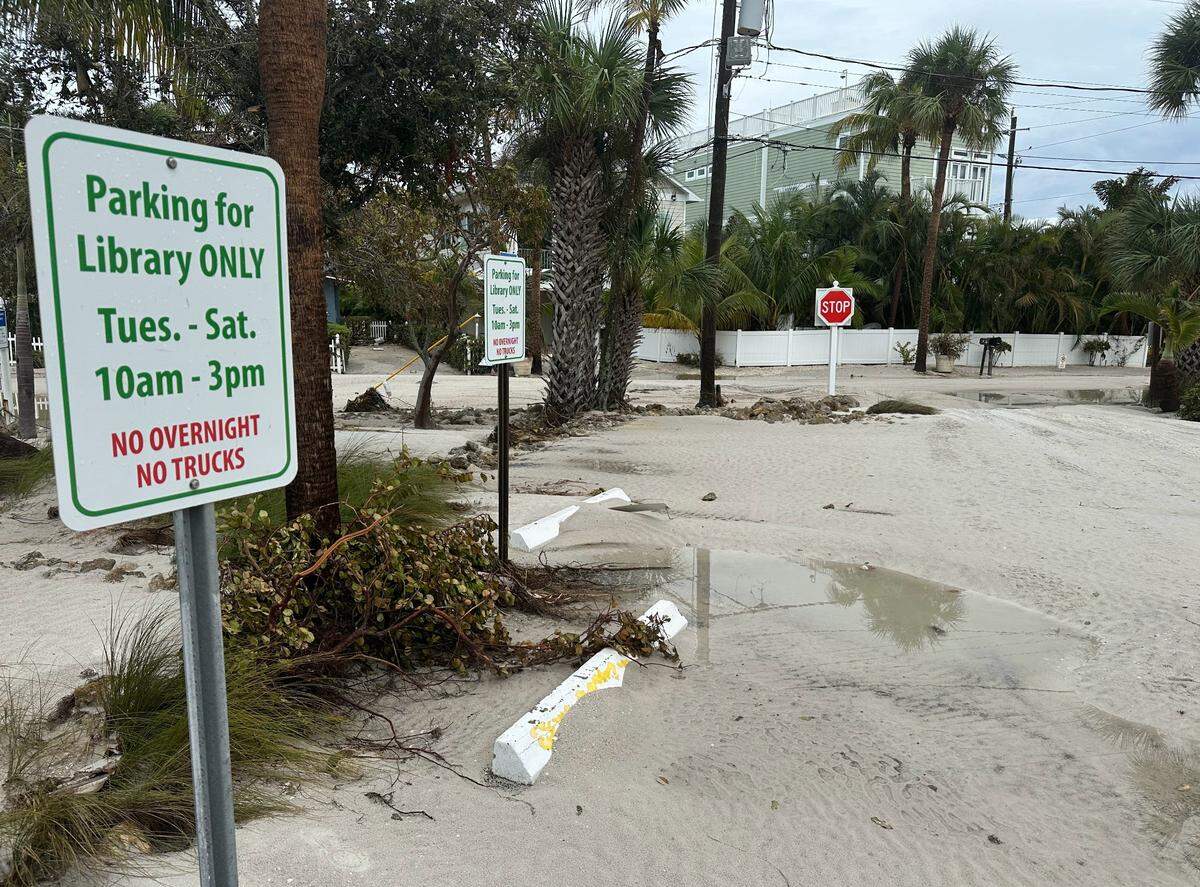 Hurricane Helene piled feet of sand in the parking lot of the Tingley Memorial Library in Bradenton Beach on Anna Maria Island as the Category 4 storm passed Manatee County in the Gulf of Mexico.