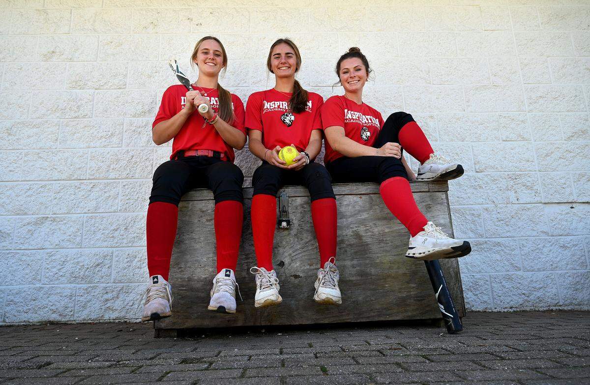 Avery Bouquin, 17, Jade Carnahan, 16, and Danika Best, 18, of Inspiration Academy’s softball team.
