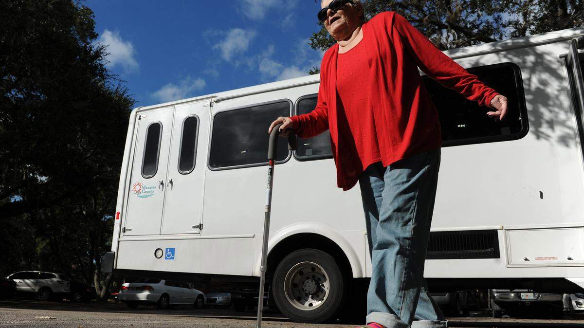 Valerie Matice walks to the Bradenton Dialysis Center after being dropped off for an appointment Thursday by a Manatee County Handy Bus.GRANT JEFFERIES/Bradenton Herald