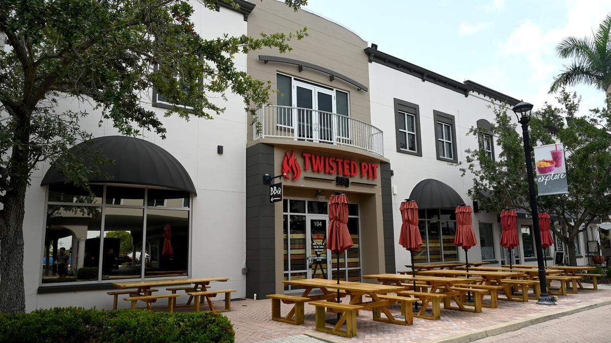 The exterior has picnic benches for outdoor dining at the Twisted Pit BBQ on Main Street in Lakewood Ranch.