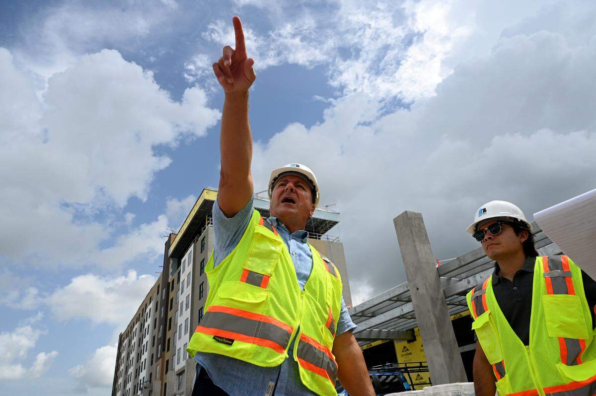 Greg Ciaccio, general manager and Christian Krause of Marriott point out features of the new Marriott Palmetto Resort at the Bradenton Area Convention Center.