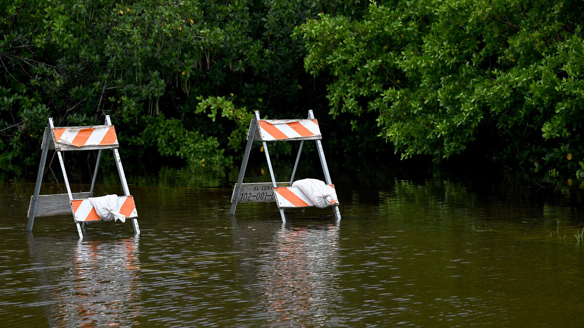 A home in Rubonia is surrounded by water on 71st Street East after Hurricane Debby swept through the area on Monday, Aug. 5, 2024.