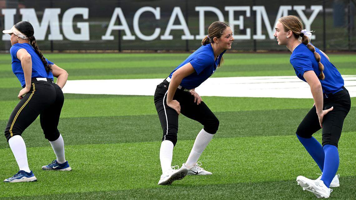 Bree McHughes, center, trains with other recruits at IMG’s new softball facilities on Softball Prospect Day.