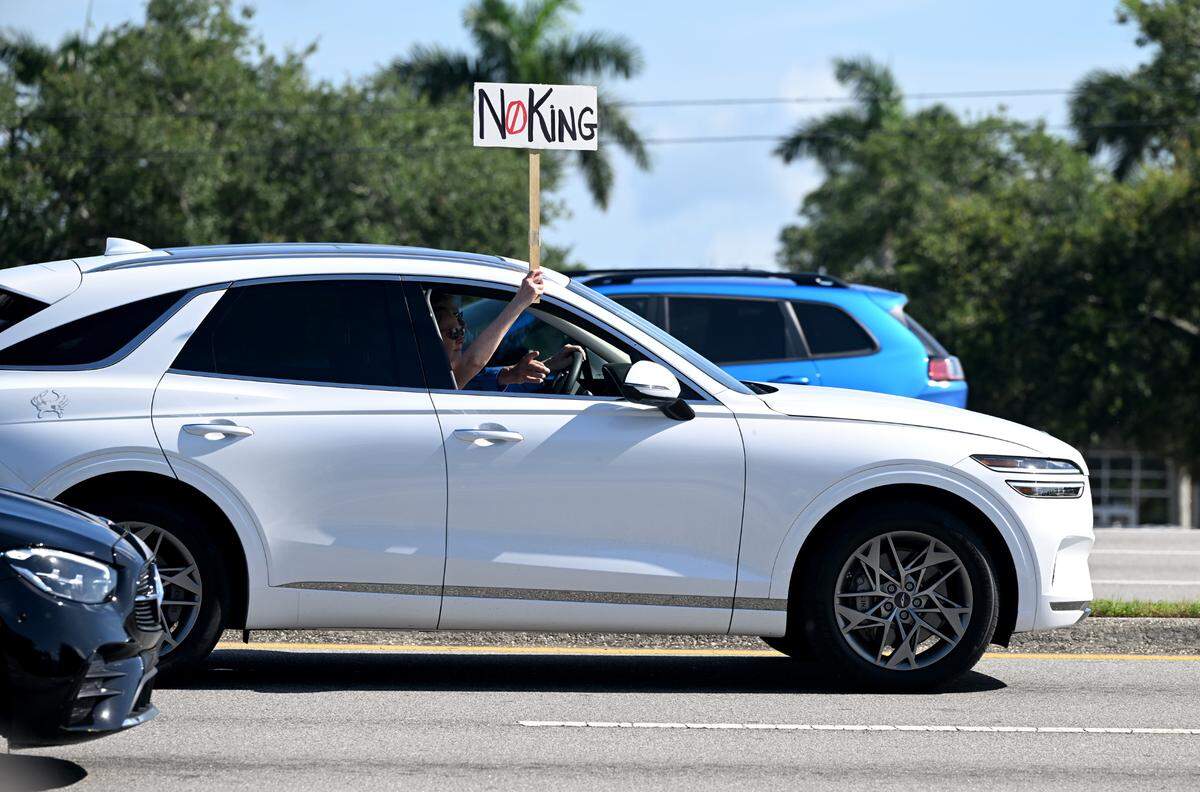 A passing motorist held up a sign as hundreds attended the No Kings protest organized by Indivisible Manatee near the University Town Center along University Parkway in Sarasota on June 14, 2025.