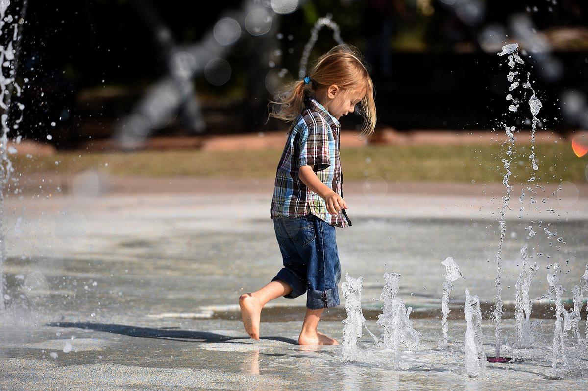 DeAdra Sunset and her almost-four-year old son, Dacian, play at Riverwalk. DeAdra left an abusive relationship to start over in Bradenton with her son.
