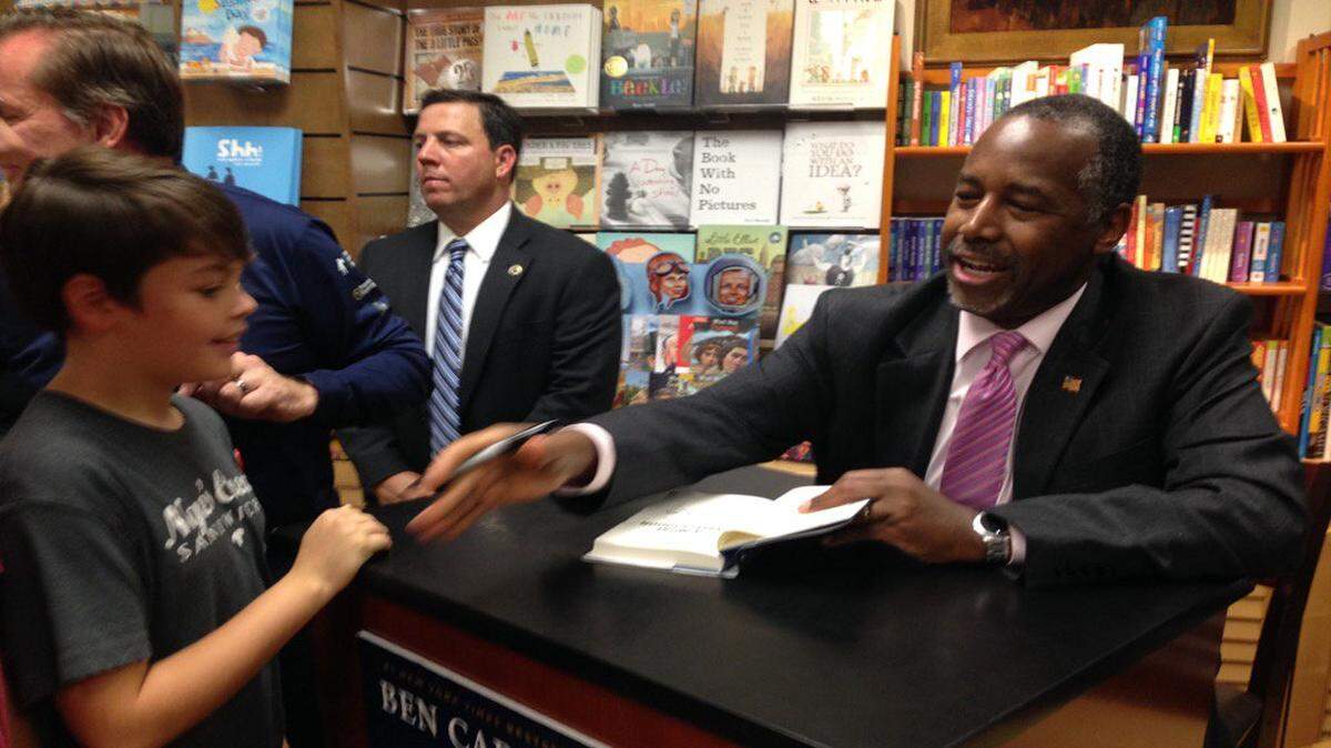 Republican presidential candidate Ben Carson is greeting the public and signing books in Sarasota on Wednesday.