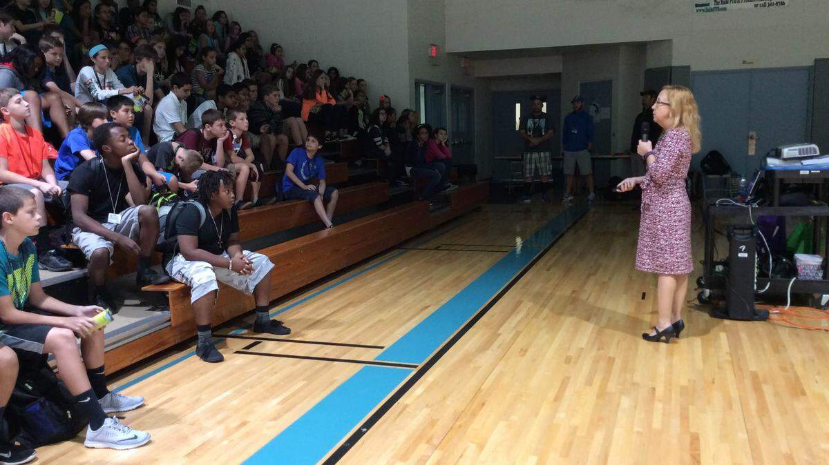 Ginger Brengle, a representative from Mothers Against Drunk Driving, speaks to Haile Middle School students on Tuesday as part of Red Ribbon Week. MEGHIN DELANEY / BRADENTON HERALD