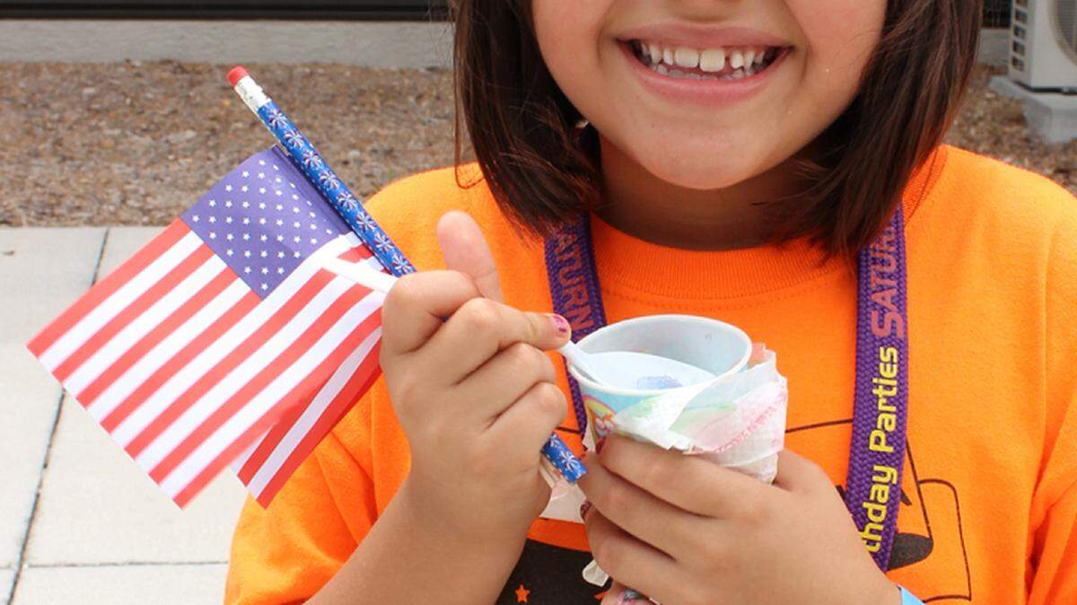 Brianna Castillo enjoys a special treat at lunch at North Sarasota Library as part of All Faiths Food Bank summer program to feed school children during the summer break.PHOTO PROVIDED