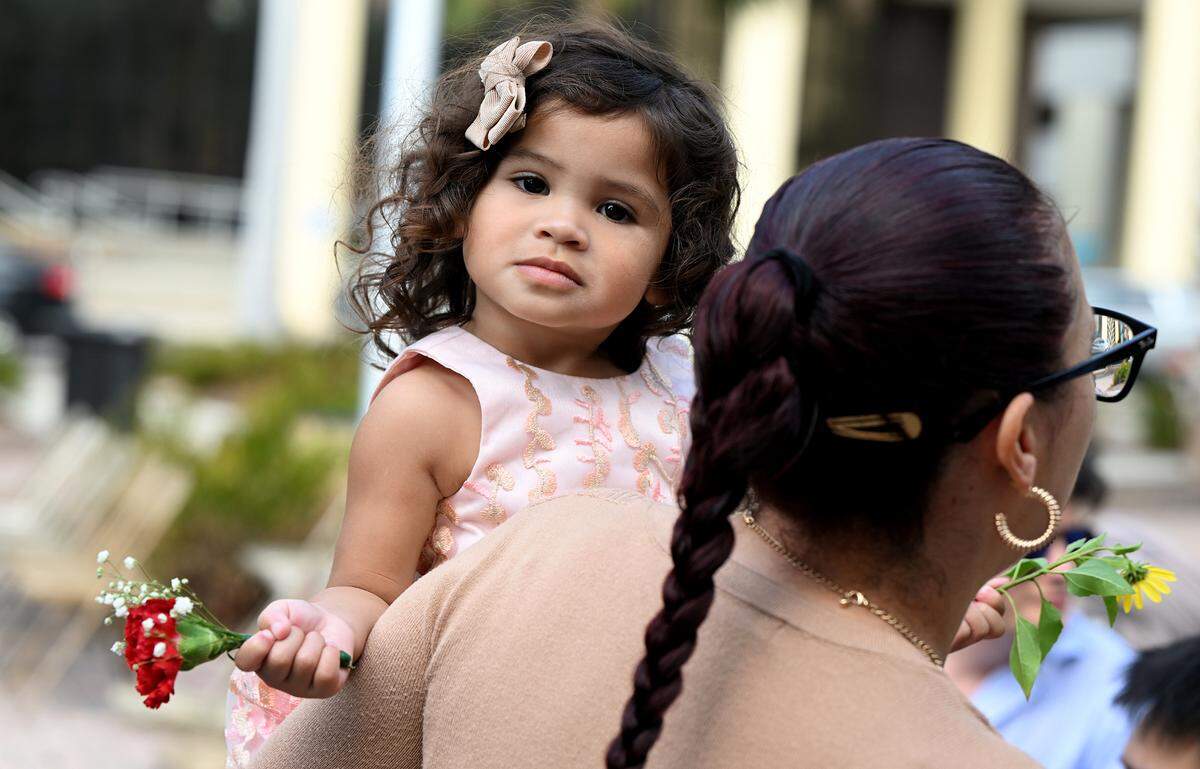 Jairy Herrera, 2, at the Fifth Annual Valentine’s Day Group Wedding in the courtyard of the Manatee County Historical Courthouse.