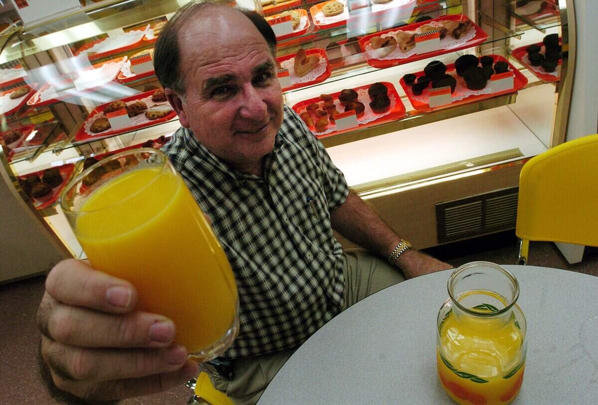 Dean Mixon of Mixon Fruit holds the first juice of the season in 2005