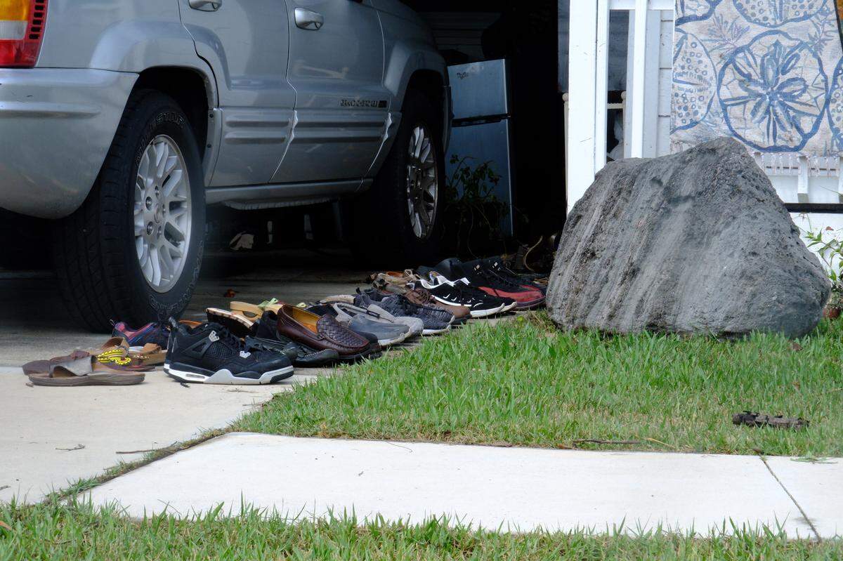 Shoes are left out to dry outside one of the many homes in Rubonia flooded by Hurricane Helene’s storm surge.