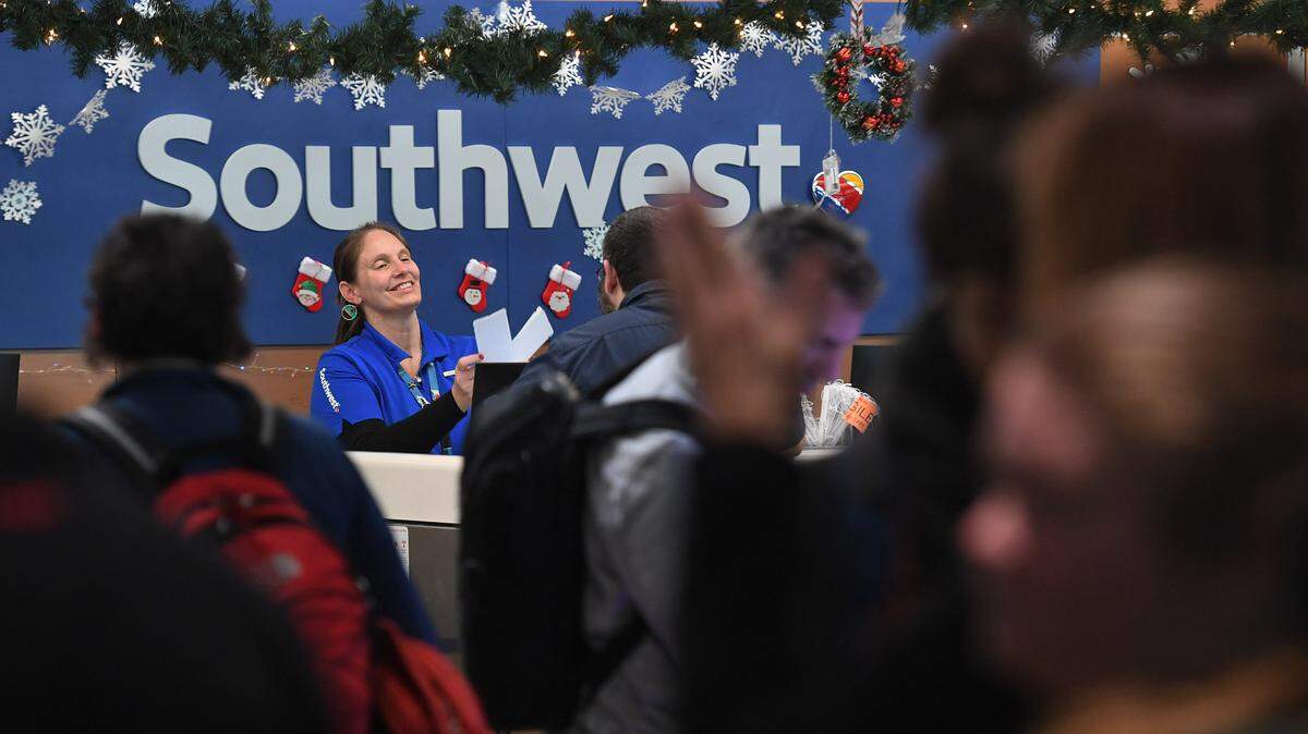 Passengers line up at the ticket counters at the Sarasota Bradenton International Airport where 13 arrivals and 12 departures were canceled on the morning of Dec. 27, 2022.