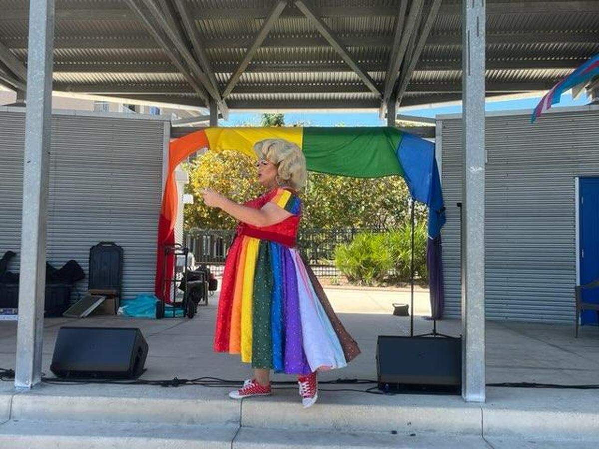 Drag queen performer Momma Ashley Rose, of Rose Dynasty, a Central Florida nonprofit that mentors LGBTQ+ youth, sings and struts before the crowd at Manatee Pride in Bradenton on March 11, 2023.