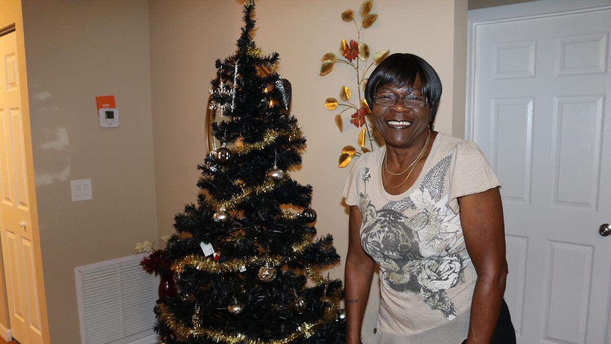 Mimi Williams is thrilled to be in her own house in time for Christmas. She overcame homelessness and time in prison to become a Bradenton homeowner.