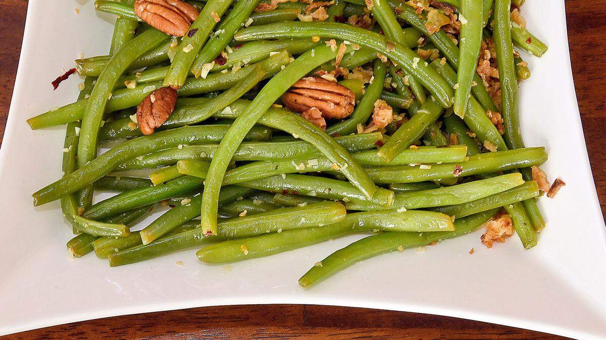 Skip the same old green bean casserole with condensed mushroom soup and go instead with this citrusy version that has a slight bite to it. 
 Photos by Pittsburgh Post-Gazette/TNS