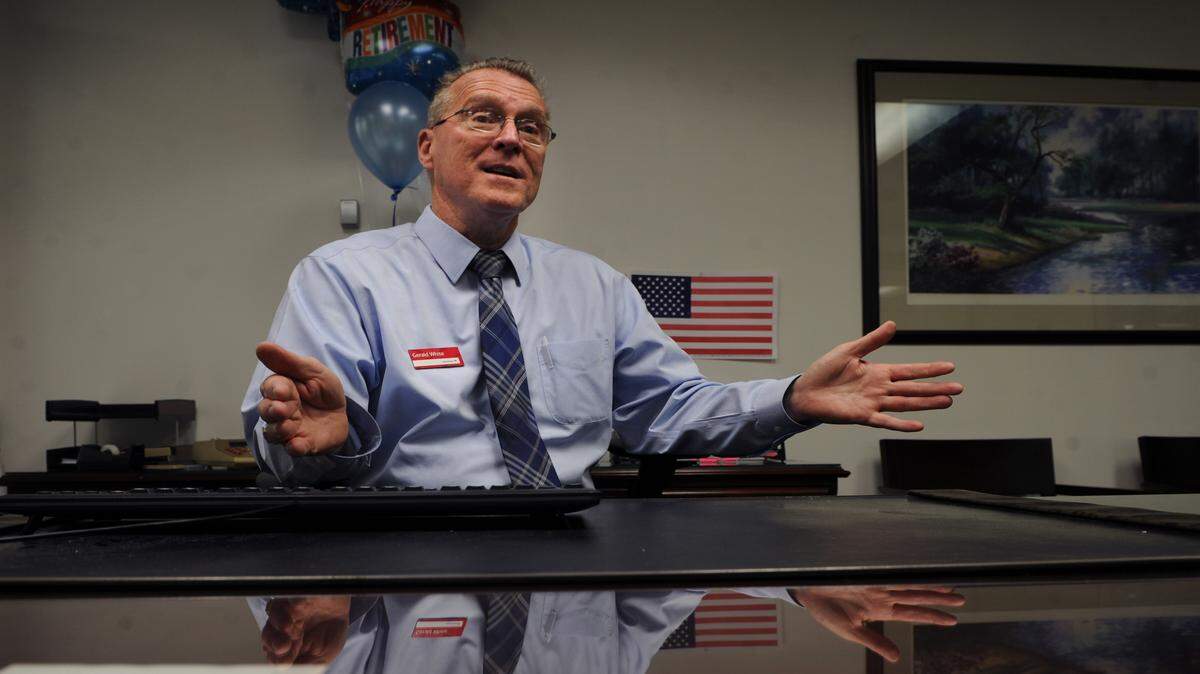 Gerald White, vice president of Bank of America in Palmetto, talks about his retirement on Tuesday, his last day after 42 years of service. 
 GRANT JEFFERIES/Bradenton Herald