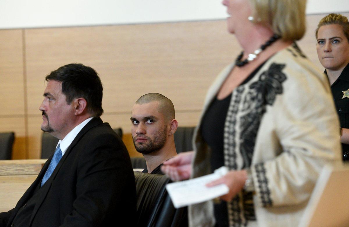 Alan Baily looks at Michelle Cherp as she passes in the court room before he was sentenced to life in prison for the killing of Alexander Cherp in 2017.