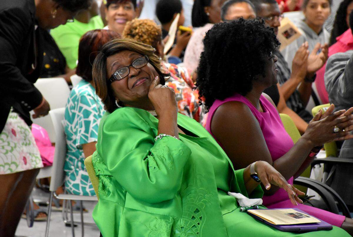 Former teacher and Manatee School Board member Barbara Harvey smiles while sitting in the audience during a ribbon-cutting ceremony for Barbara A. Harvey Elementary School in Parrish on July 27, 2019.